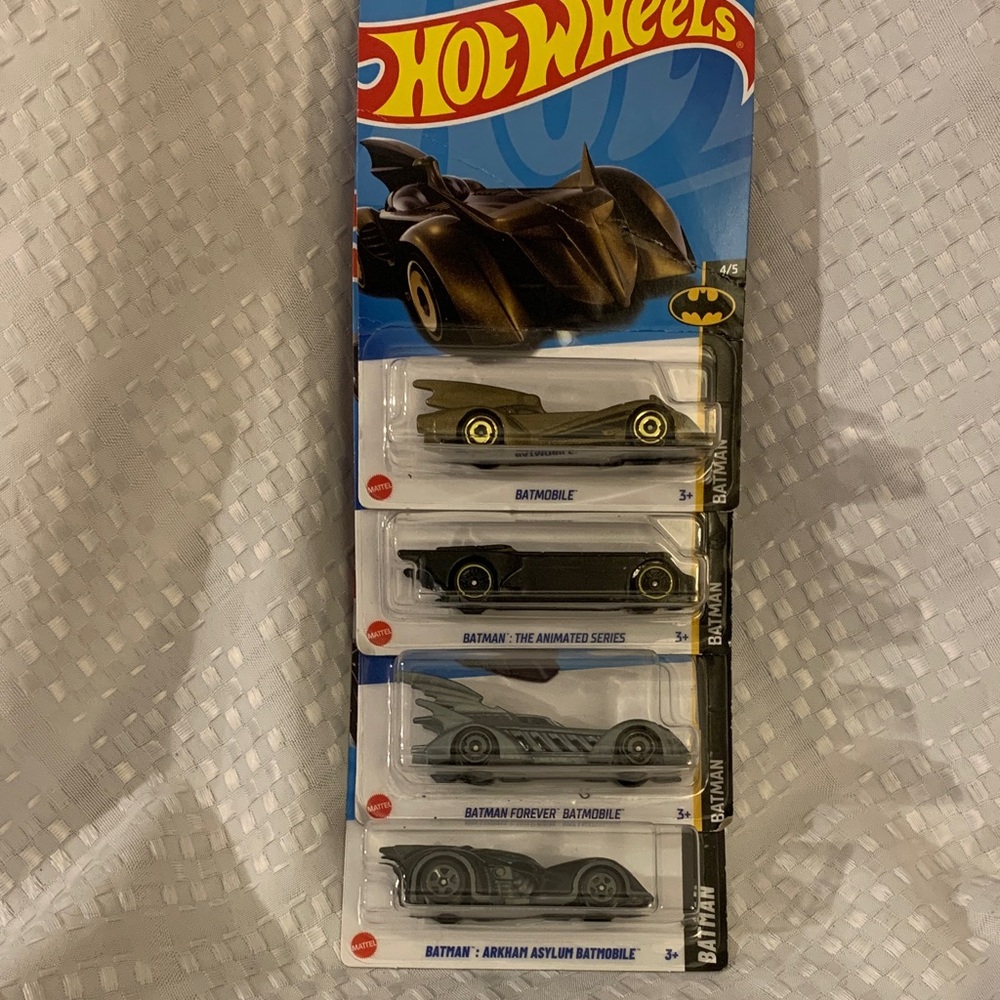 Hot Wheels Batman vehicles; 4 different cars, new in packages.